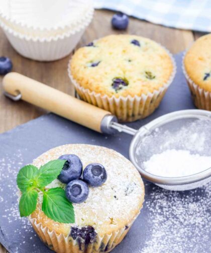 Ina Garten Coffee Cake Blueberry Muffins Recipe Ina Garten Coffee Cake Blueberry Muffins Recipe Ingredients 12 tablespoons (1 1/2 sticks) unsalted butter, at room temperature 1 1/2 cups sugar 3 extra-large eggs, at room temperature 1 1/2 teaspoons pure vanilla extract 8 ounces (about 1 cup) sour cream 1/4 cup milk 2 1/2 cups all-purpose flour 2 teaspoons baking powder 1/2 teaspoon baking soda 1/2 teaspoon kosher salt 2 half-pints fresh blueberries, picked through for stems How To Make Ina Garten Coffee Cake Blueberry Muffins Recipe Preheat oven and prep pans: Set your oven to 350°F. Line 16 muffin cups with paper liners. Cream butter and sugar: In a stand mixer or with hand beaters, cream the butter and sugar on medium-high speed for about 5 minutes, until light and fluffy. Add wet ingredients: Beat in eggs one at a time. Then mix in vanilla, sour cream, and milk. Mix dry ingredients: In a separate bowl, sift together flour, baking powder, baking soda, and salt. Gradually add the dry ingredients to the wet, mixing just until combined. Fold in blueberries: Gently stir in the blueberries with a spatula to avoid crushing them. Fill and bake: Scoop the batter into the prepared muffin cups, filling each just over the top. Bake and cool: Bake for 25–30 minutes until golden and a toothpick comes out clean. Let cool in the pan for 5 minutes, then transfer to a wire rack. Recipe Tips How to prevent blueberries from sinking: Toss them in a tablespoon of flour before folding into the batter. Can I use frozen blueberries? Yes, but do not thaw—fold them in directly from the freezer to prevent bleeding. What’s the best sour cream substitute? Greek yogurt works well and gives a similar moisture and tang. How to get domed muffin tops: Fill the cups generously and make sure your oven is fully preheated before baking. Can I add a crumb topping? Yes! Mix butter, flour, sugar, and cinnamon for a streusel to sprinkle on top before baking. What To Serve With Blueberry Muffins These muffins are perfect for breakfast or snacks, especially when paired with: Hot coffee or tea Fresh fruit salad Yogurt and granola Scrambled eggs or quiche Honey butter or cream cheese spread How To Store Blueberry Muffins Room Temperature: Store in an airtight container for up to 2 days. Refrigerate: Store for up to 5 days, but reheat slightly before serving to restore moisture. Freeze: Wrap muffins tightly and freeze for up to 2 months. Thaw at room temperature or microwave for 30 seconds. Blueberry Muffins Nutrition Facts Calories: 200 Protein: 3g Fat: 9g Carbohydrates: 28g Sugar: 15g Fiber: 1g Sodium: 120mg Nutrition information is estimated and may vary based on ingredients and cooking methods used. FAQs Can I use a different berry? Yes, raspberries or chopped strawberries work well—just make sure to pat them dry before using. Why are my muffins dry? They may be overbaked. Check doneness early and store them properly to retain moisture. How do I make jumbo muffins? Use a jumbo muffin tin and bake a few minutes longer, checking for doneness with a toothpick. Can I make these gluten-free? Yes, substitute with a 1:1 gluten-free flour blend. What’s the difference between these and cupcakes? These muffins are less sweet, have a denser crumb, and no frosting—perfect for breakfast.